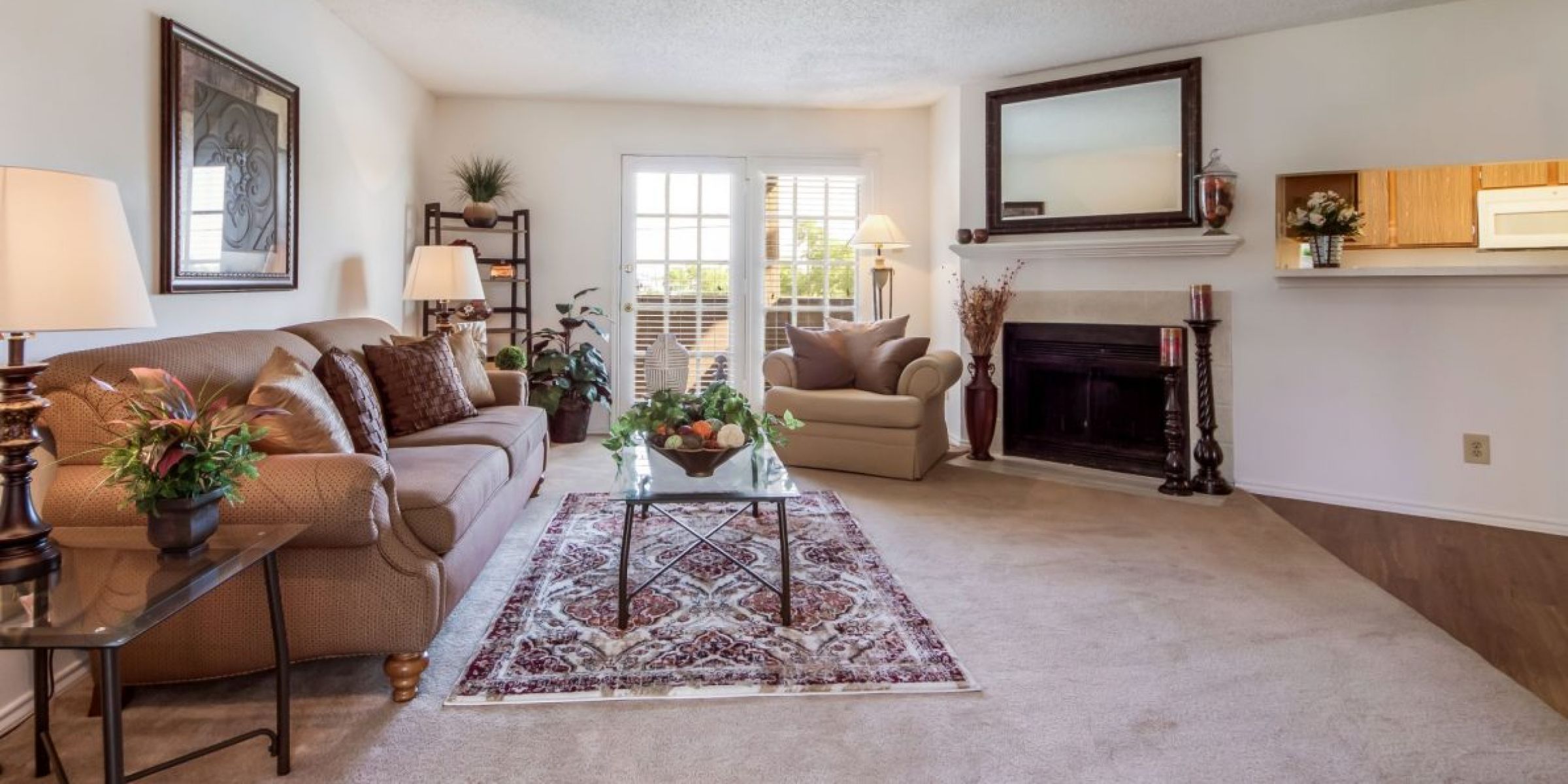 Luxury apartment living room with large windows, wood style floors and contemporary furniture at The Civic at Frisco Square